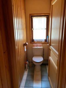 a small bathroom with a toilet and a window at Villa du Lys Bagnères de Luchon in Luchon +32 photos