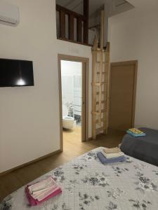 a bedroom with a bed and a view of a bathroom at B&B Stella Irpina in Teora