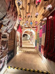 a hallway in a building with colorful tiles on the walls at Hira Cave Hotel in Göreme +161 photos