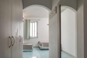 Una cama o camas en una habitación de Hotel Corallaro