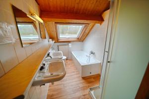 a small bathroom with a sink and a toilet at Chalet Le Mirador in Durbuy +22 photos