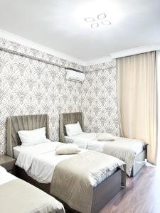 Voodi või voodid majutusasutuse Armenia Hotel toas