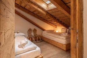 Ένα ή περισσότερα κρεβάτια σε δωμάτιο στο Casa Sciatore, a Cortina d Ampezzo