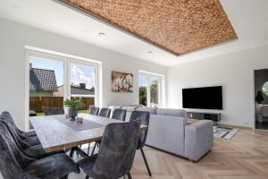 a living room with a couch and a table at Posti villa 2 in Pärnu