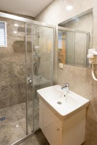 a bathroom with a sink and a shower at hotel di poesia deluxe in Istanbul