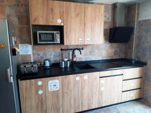A kitchen or kitchenette at El Granado Hostel