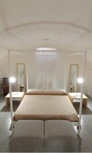 A bed or beds in a room at Casa Vacanza "La Mangiatoia in corte"
