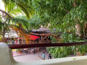 a group of people walking around a playground at Hotel Castillo Del Mar - 5 Th Ave in Playa del Carmen
