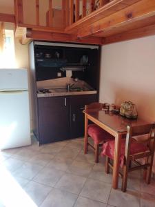 Kuchyň nebo kuchyňský kout v ubytování Kimi apartments