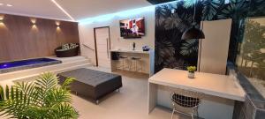 a room with a bar with a bench and a sink at Amaretto Motel - Adults Only in Arcoverde