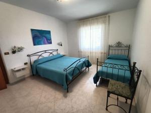 Postel nebo postele na pokoji v ubytování La casa di Gerry