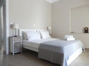 Posteľ alebo postele v izbe v ubytovaní Mellow mood Tinos Town