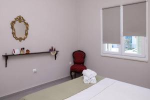 Posteľ alebo postele v izbe v ubytovaní Mellow mood Tinos Town