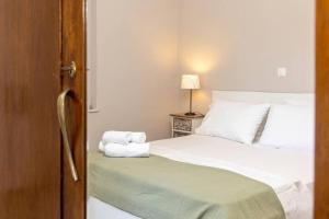 Posteľ alebo postele v izbe v ubytovaní Mellow mood Tinos Town
