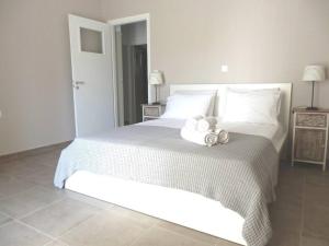 Posteľ alebo postele v izbe v ubytovaní Mellow mood Tinos Town