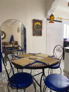 a group of tables and chairs in a room at Tarbouche on the Beach in Essaouira