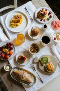 a table with plates of food on a table at Cuprena in Arezzo