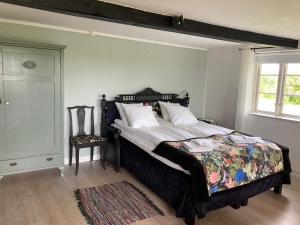 A bed or beds in a room at Lunkaberg Bed & Breakfast