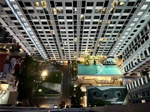 an overhead view of a building with a swimming pool at The Base Central Pattaya Super condo in Pattaya Central