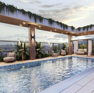 a swimming pool on the roof of a building at New Coliving Ecuador Luxury Residences in Quito