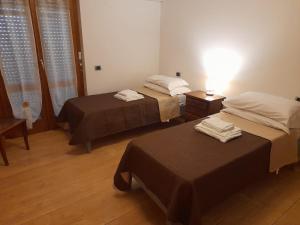 Postel nebo postele na pokoji v ubytování Casa Palombara - Baschi