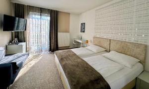 Postelja oz. postelje v sobi nastanitve Boutique Hotel Oase