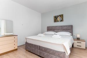 Postel nebo postele na pokoji v ubytování Apartments Gisela