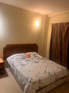 En eller flere senge i et værelse på A sweet home for your trip