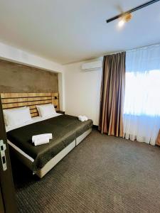 Ένα ή περισσότερα κρεβάτια σε δωμάτιο στο Sremsky inn