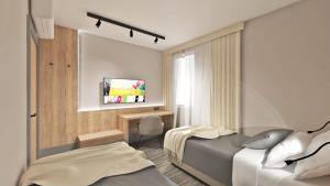 Ένα ή περισσότερα κρεβάτια σε δωμάτιο στο Sremsky inn