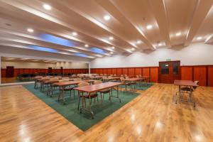 a large room with tables and chairs in it at Malachit Karpacz SPA Hotel in Karpacz +37 photos
