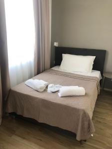 Postel nebo postele na pokoji v ubytování SOMA