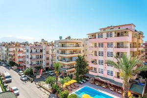an overhead view of a building with a swimming pool at Amber-Rose Apart Hotel in Alanya