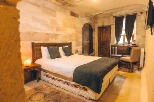 Postel nebo postele na pokoji v ubytování Solin Cave Cappadocia
