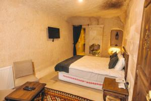 Postel nebo postele na pokoji v ubytování Solin Cave Cappadocia