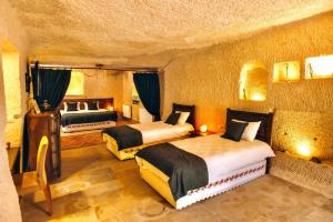 Postel nebo postele na pokoji v ubytování Solin Cave Cappadocia