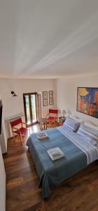 Ένα ή περισσότερα κρεβάτια σε δωμάτιο στο Casa Marianna