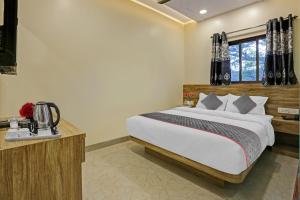 Postel nebo postele na pokoji v ubytování Hotel O Kiwi International