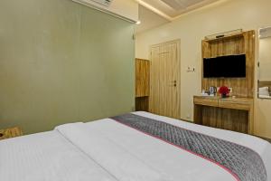Postel nebo postele na pokoji v ubytování Hotel O Kiwi International