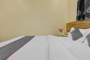 Postel nebo postele na pokoji v ubytování Hotel O Kiwi International