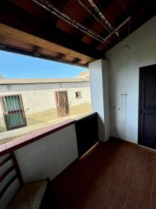 a room with a large window in a building at Al Civico 15 in Grosseto +2 photos