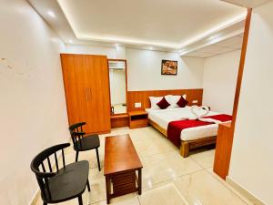 Ένα ή περισσότερα κρεβάτια σε δωμάτιο στο Hotel Starfinch Inn