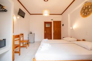 Postel nebo postele na pokoji v ubytování Melissa Rooms Naxos