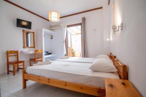 Postel nebo postele na pokoji v ubytování Melissa Rooms Naxos