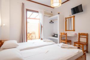 Postel nebo postele na pokoji v ubytování Melissa Rooms Naxos