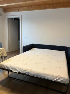 Ένα ή περισσότερα κρεβάτια σε δωμάτιο στο Larocca Tourist Home 6 Valbrenta