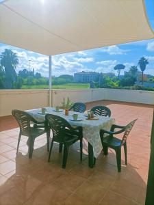 a table and chairs sitting on a patio at Camping Relax Sol in Torredembarra
