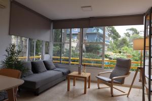 Posezení v ubytování Salouhouses Apartment Cala Crancs