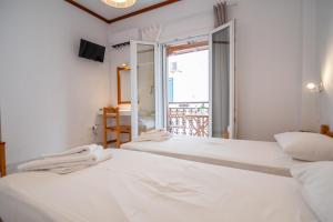 Postel nebo postele na pokoji v ubytování Melissa Rooms Naxos