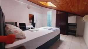 Postel nebo postele na pokoji v ubytování Guesthouse Mixe